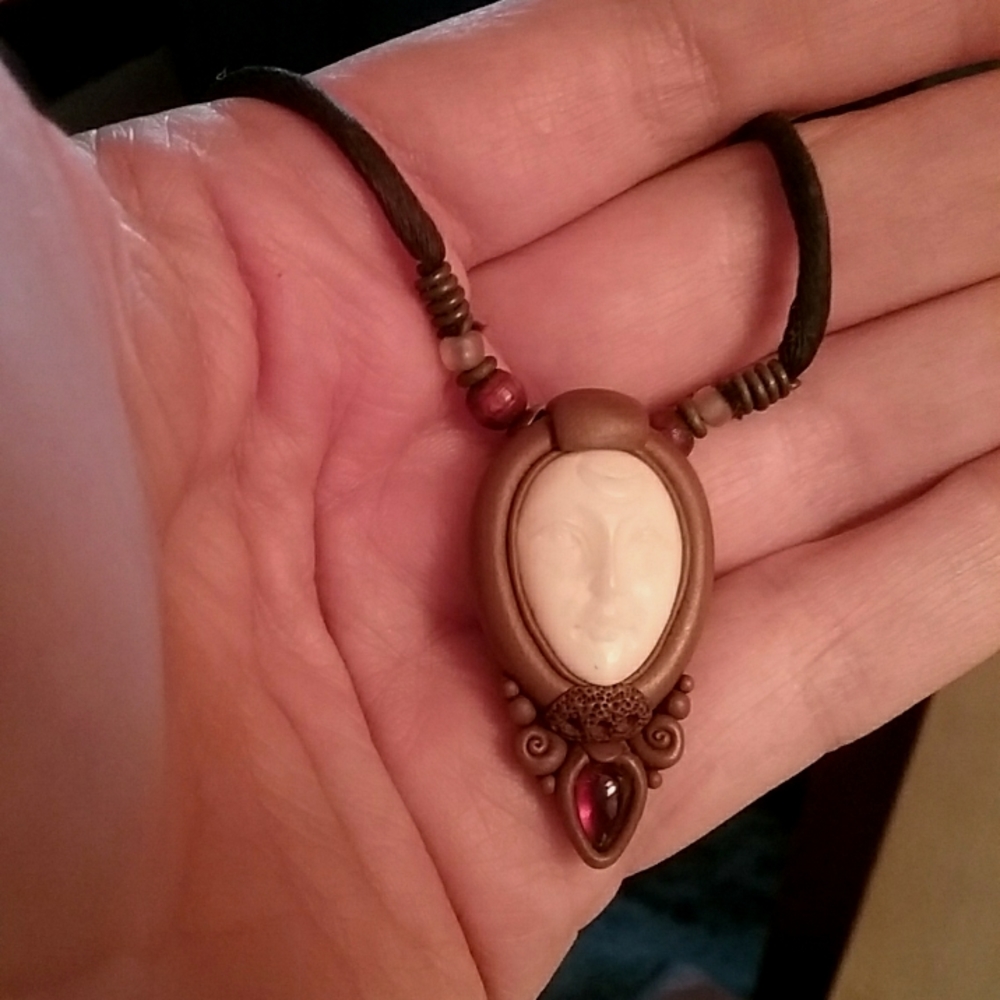 Artisan made bone face necklace